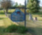 Munson Township_Fowlers Mill Cemetery Sign with Tombstones in Background