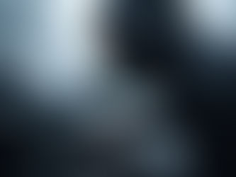 A man in a hoodie breaking into a car