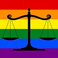 The scales of justice over the rainbow flag