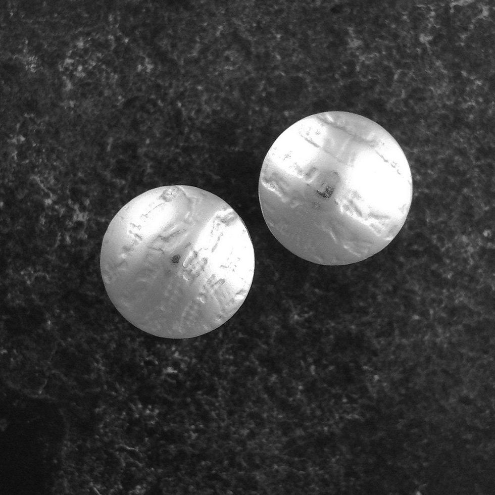 Large Silver Stud earrings with a linen texture