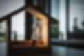 Light bulb with wood house on the table, a symbol for construction, Creative light bulb id