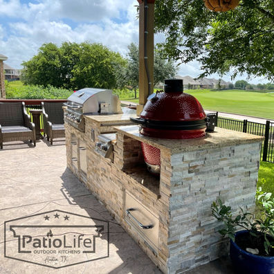 Custom outdoor kitchen island on golf course, with built-in Kamado Joe smoker, and granite countertop in Teravista, Round Rock, TX.