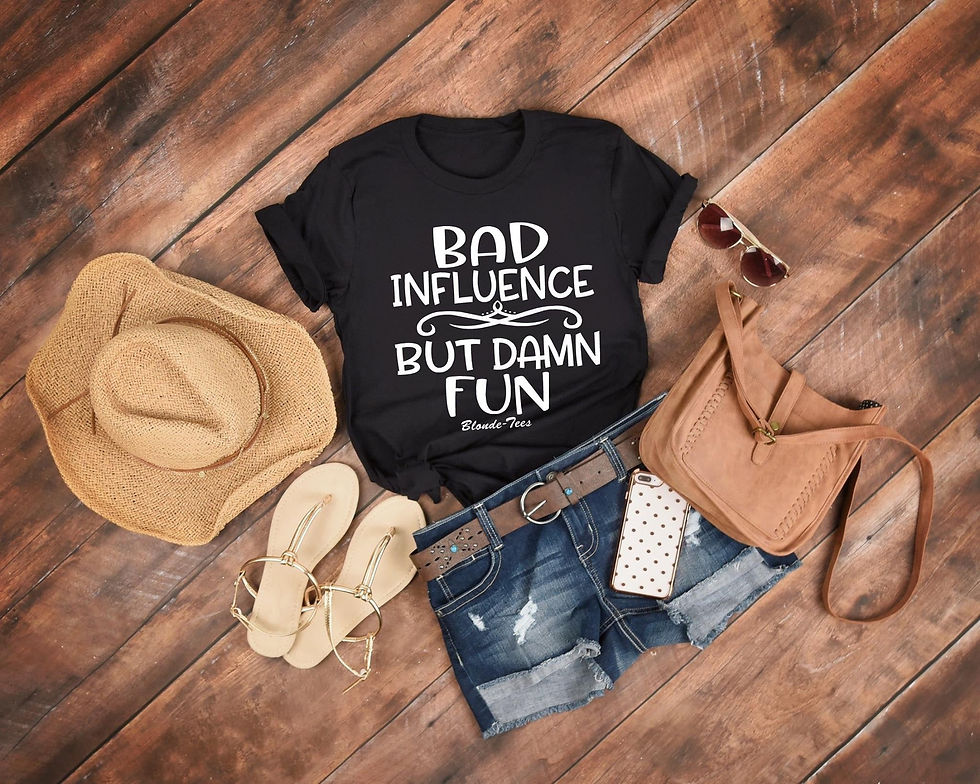 Black t-shirt with "Bad Influence But Damn Fun" on wooden background.