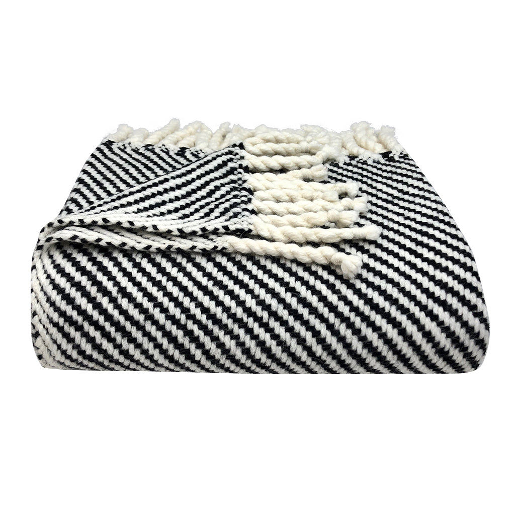 Black and white striped blanket. Alpaca Bed Blanket. Cozy, comfortable, and warm textile.