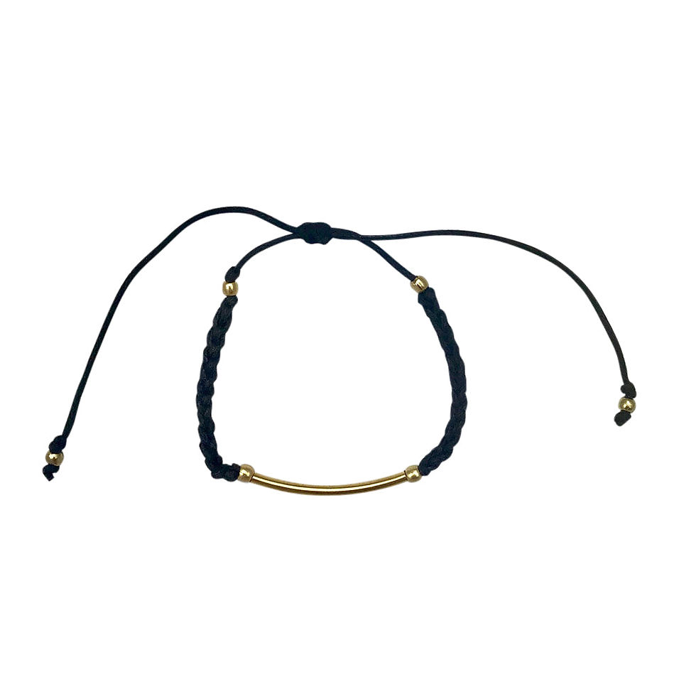 Black beaded bracelet with gold bar and adjustable ties, perfect jewelry.