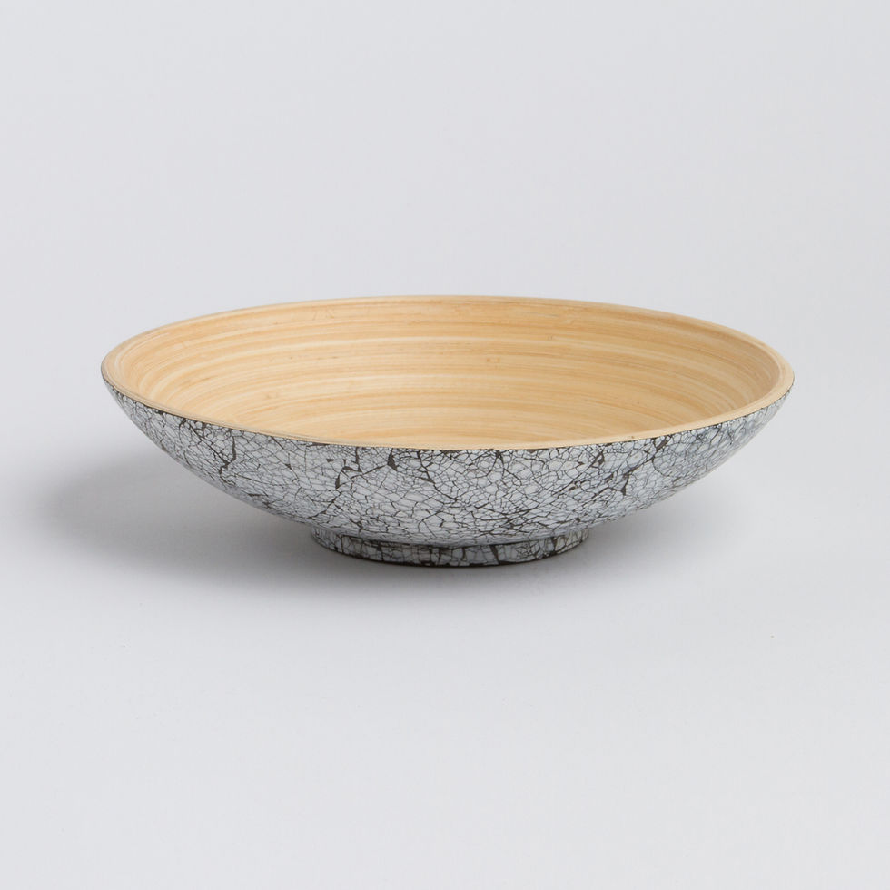 Decorative bowl with gray exterior and natural light-colored inside surface.
