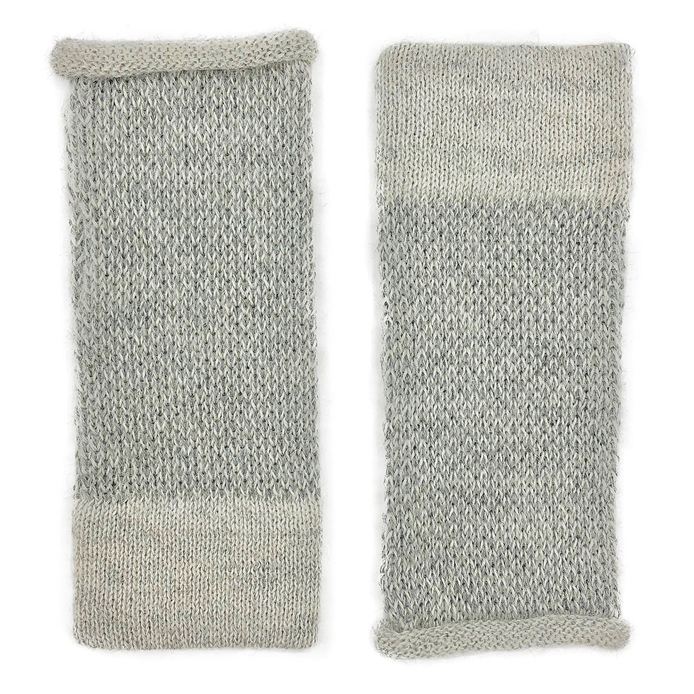 Two gray and white knitted arm warmers isolated on a white background.