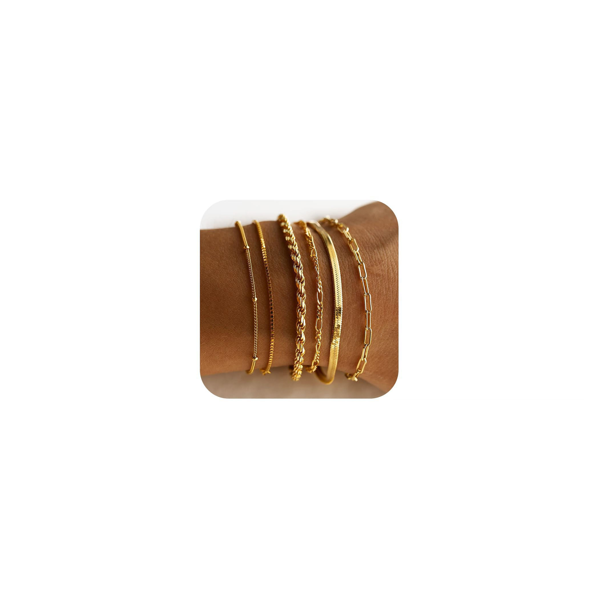 Gold bangles displayed on a brown card for sale, various stylish designs.