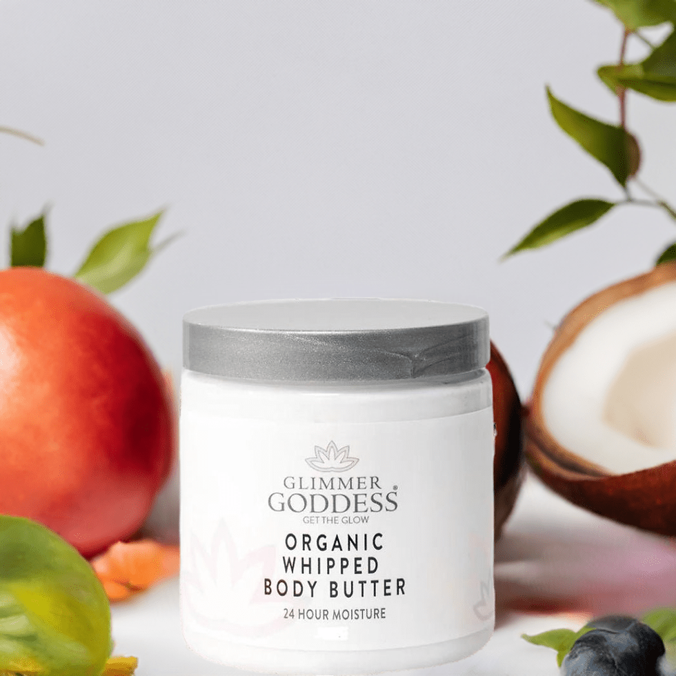 Glimmer Goddess Organic Whipped Body Butter with 24-hour moisture, near fruits.