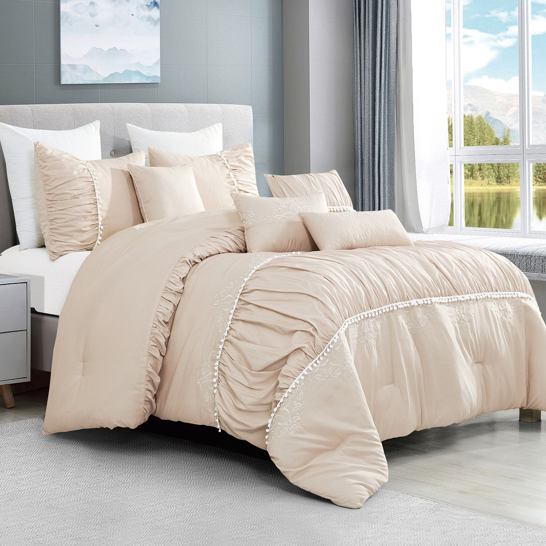 Beige comforter set on bed with pillows and window view in background