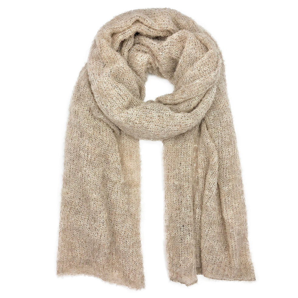Beige scarf draped elegantly. Soft, cozy texture, perfect for cold weather.