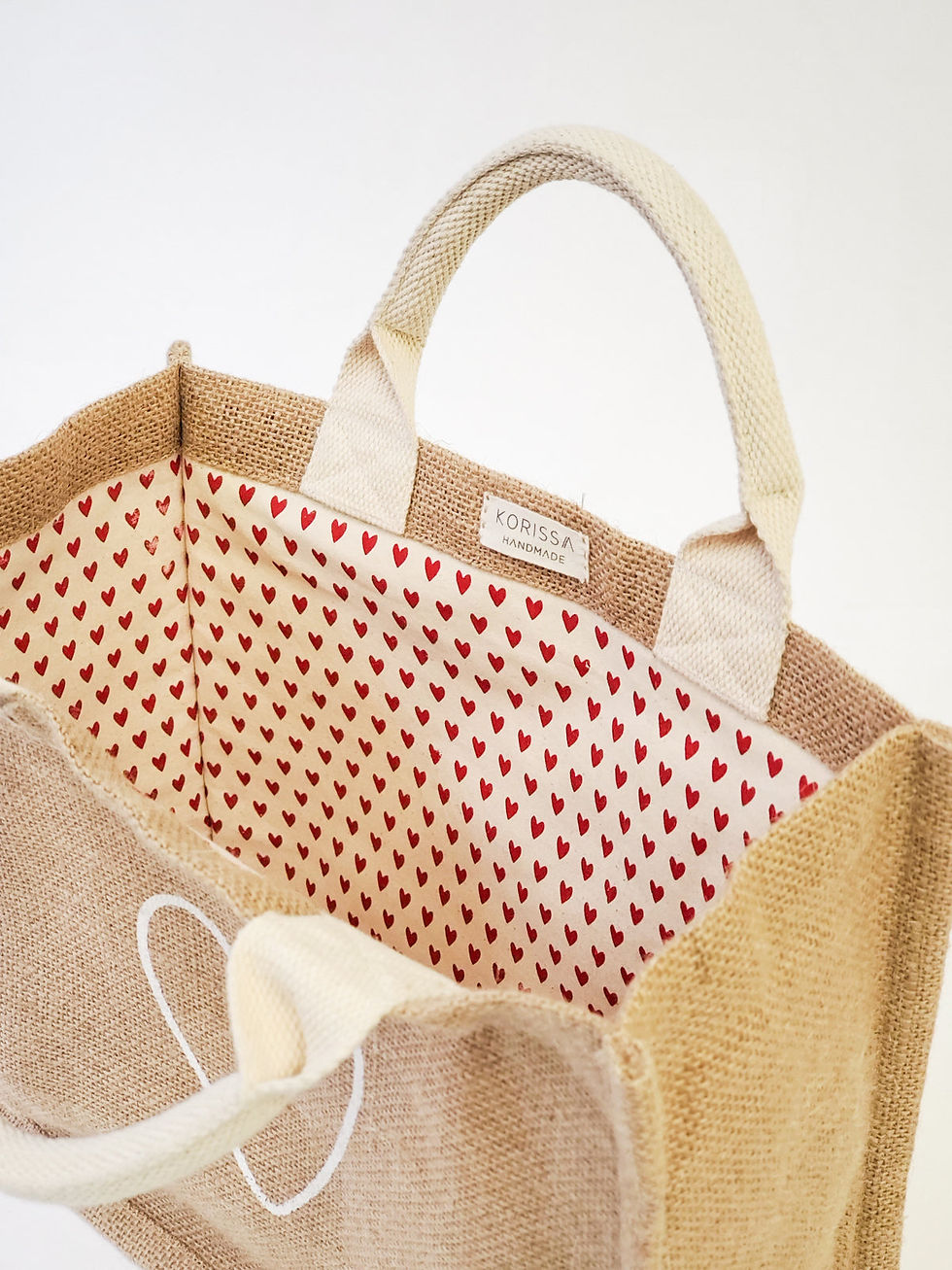 Open jute tote bag, red heart lining,