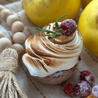 One of The Naked Sourdough's meringue-topped pastries, finishes with berries and a sprig of rosemary