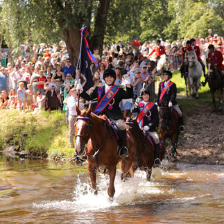 Jethart's 2025 Callant, Lewis Turnbull, fords the river on horseback on Festival Day.