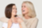 smiling senior woman with young woman enjoys the benefits of a healthy smile