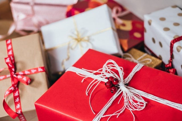 A pile of wrapped Christmas gifts