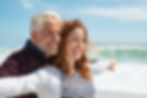 smiling senior couple showcases healthy, confident smiles