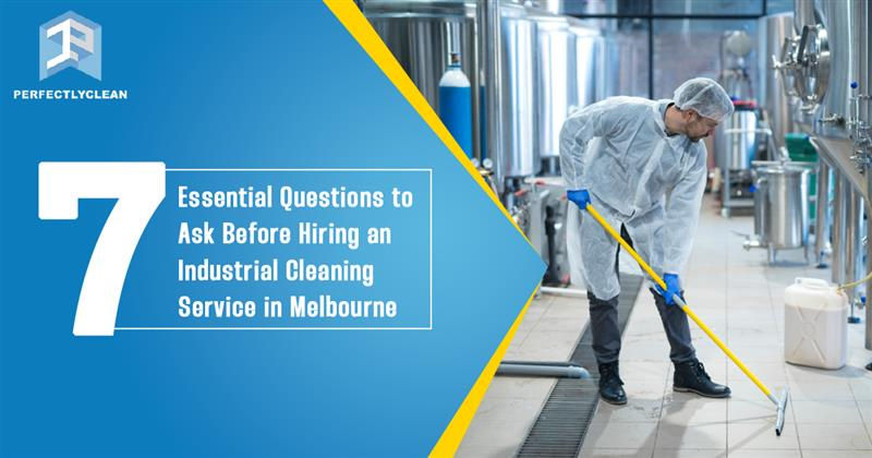 A professional cleaner in protective gear mopping the floor of an industrial facility representing industrial cleaning services in Melbourne.