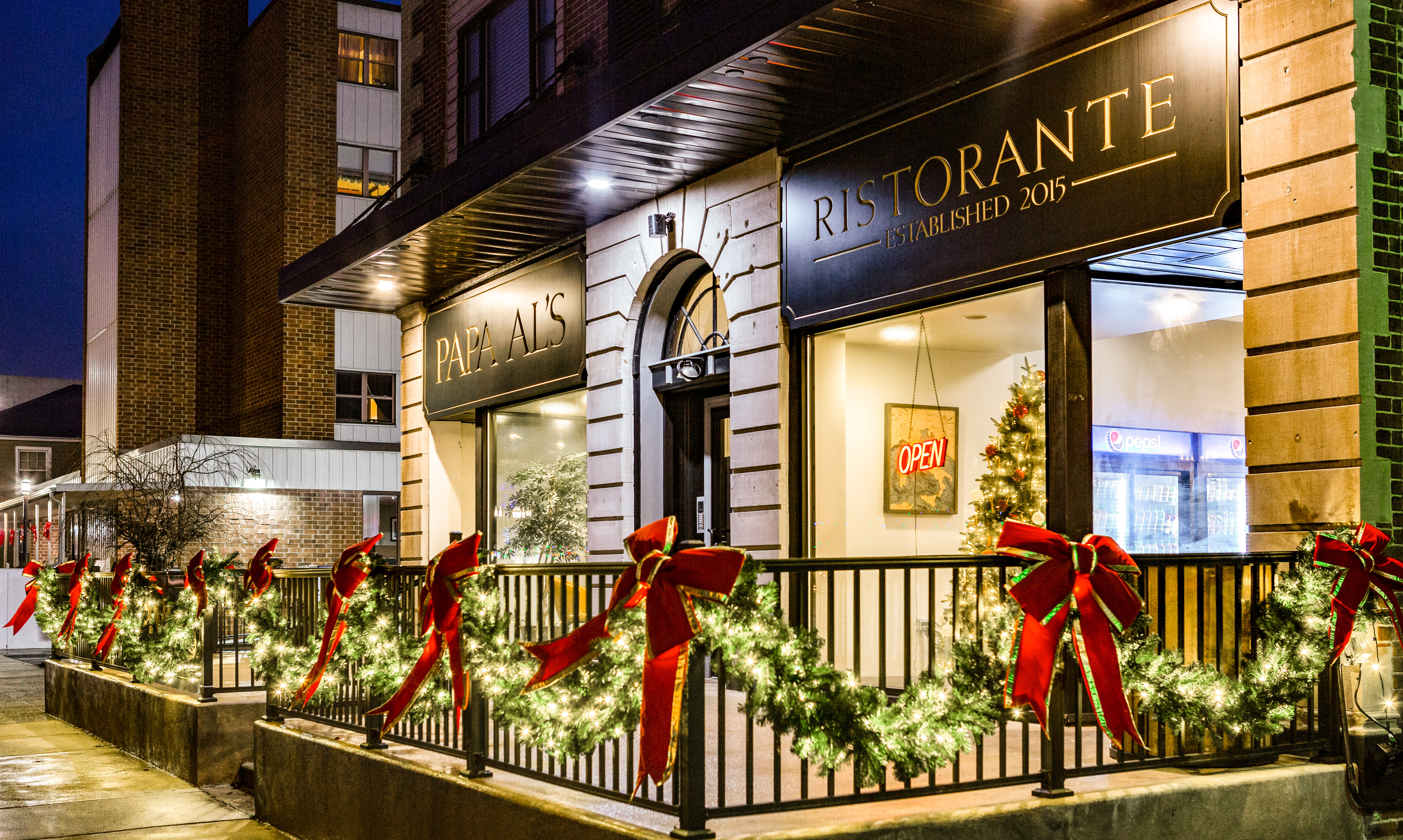 Restaurant storefront with garland and red bows