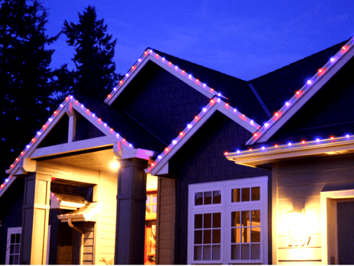Home gables outlined with permanent color-changing roofline lights