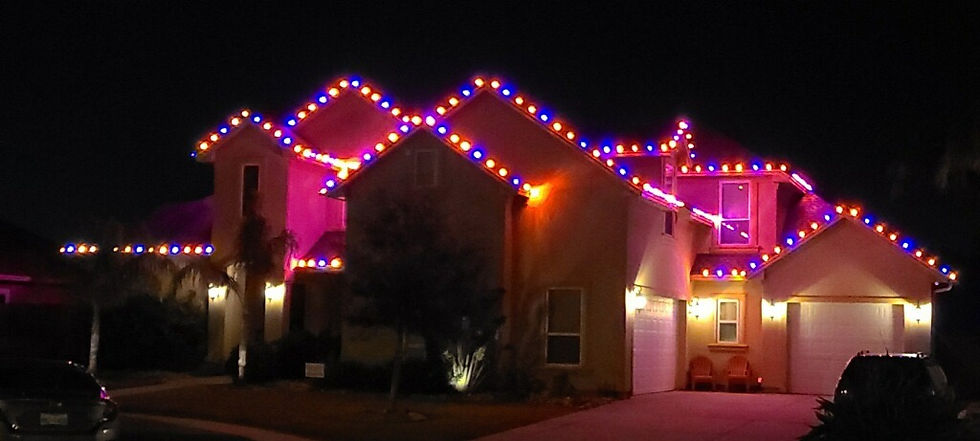 Home at night with color-changing lights along the roofline