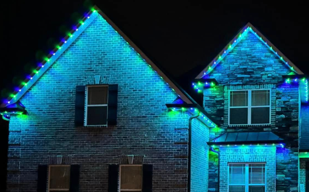 Gabled home with blue permanent lighting