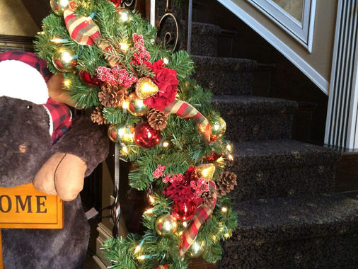Garland with ribbon on a staircase banister