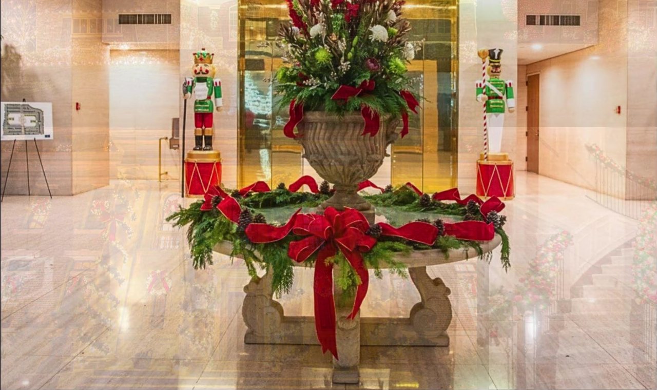 Commercial lobby holiday décor with planters and garland