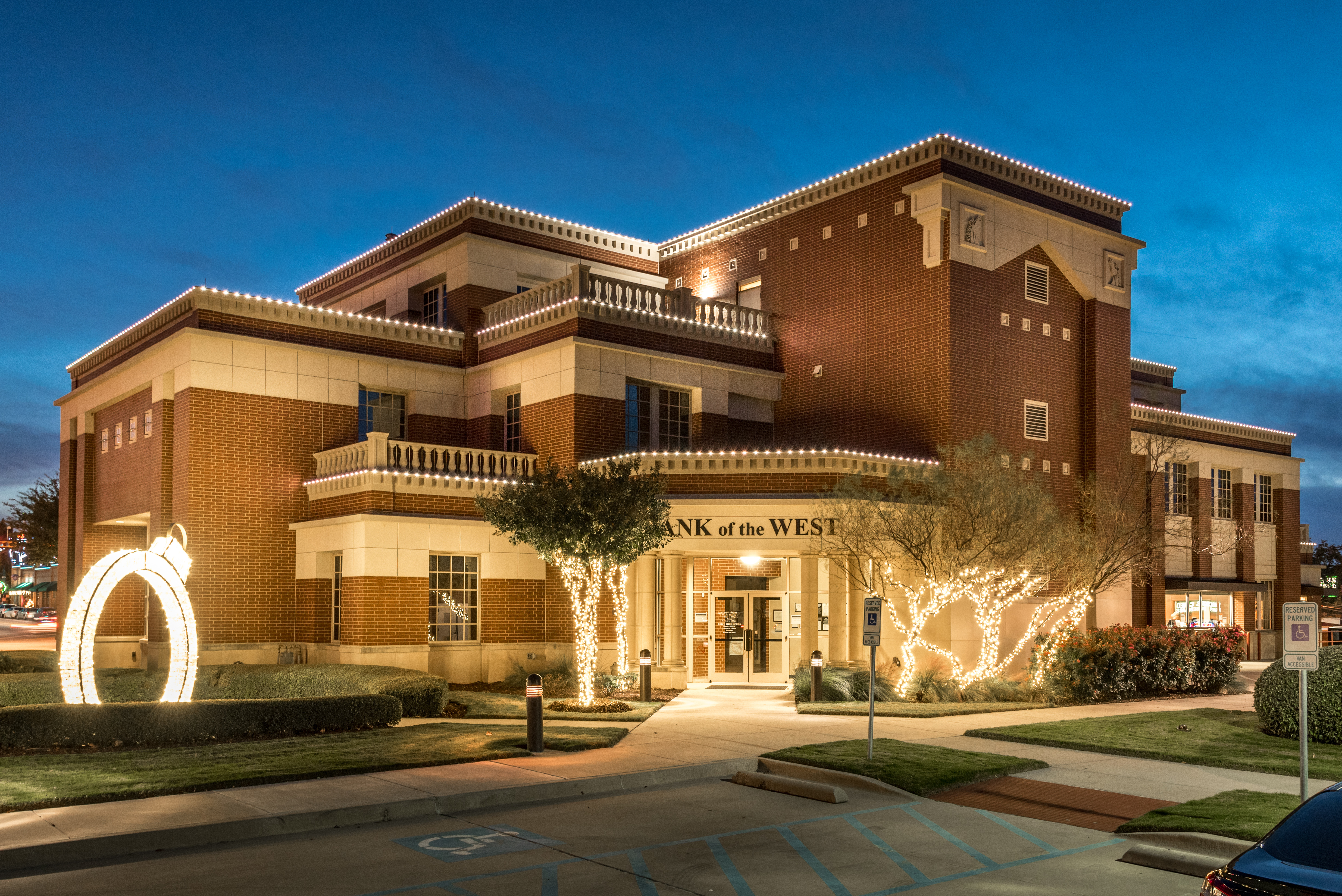 Brick office building with warm holiday lighting