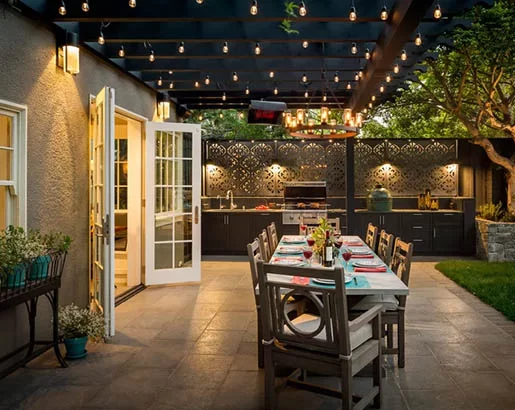 Patio dining area under bistro string lights