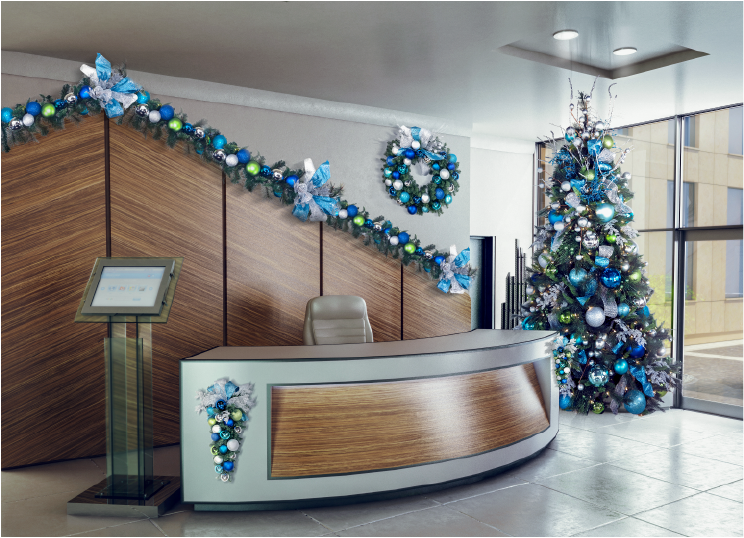 Reception desk with garland and a decorated tree