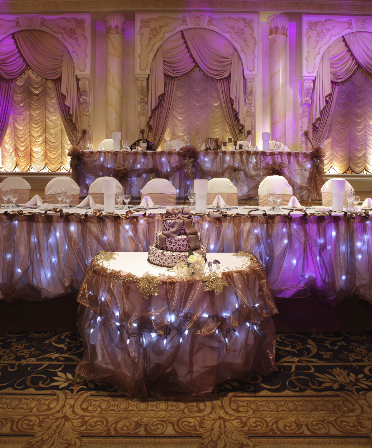 Event venue decorated with holiday and accent lighting