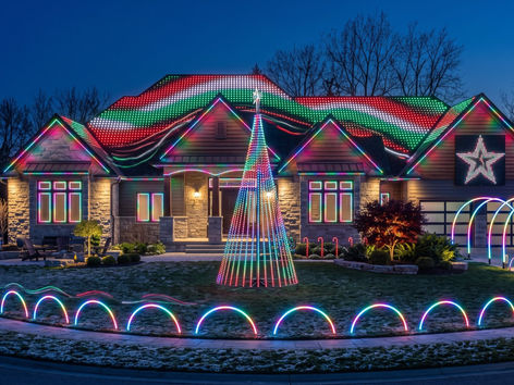 Front yard light show with a pixel mega tree, leaping arches and animated roofline