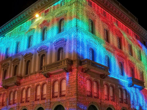 Building facade covered in multicolor RGB pixel lights