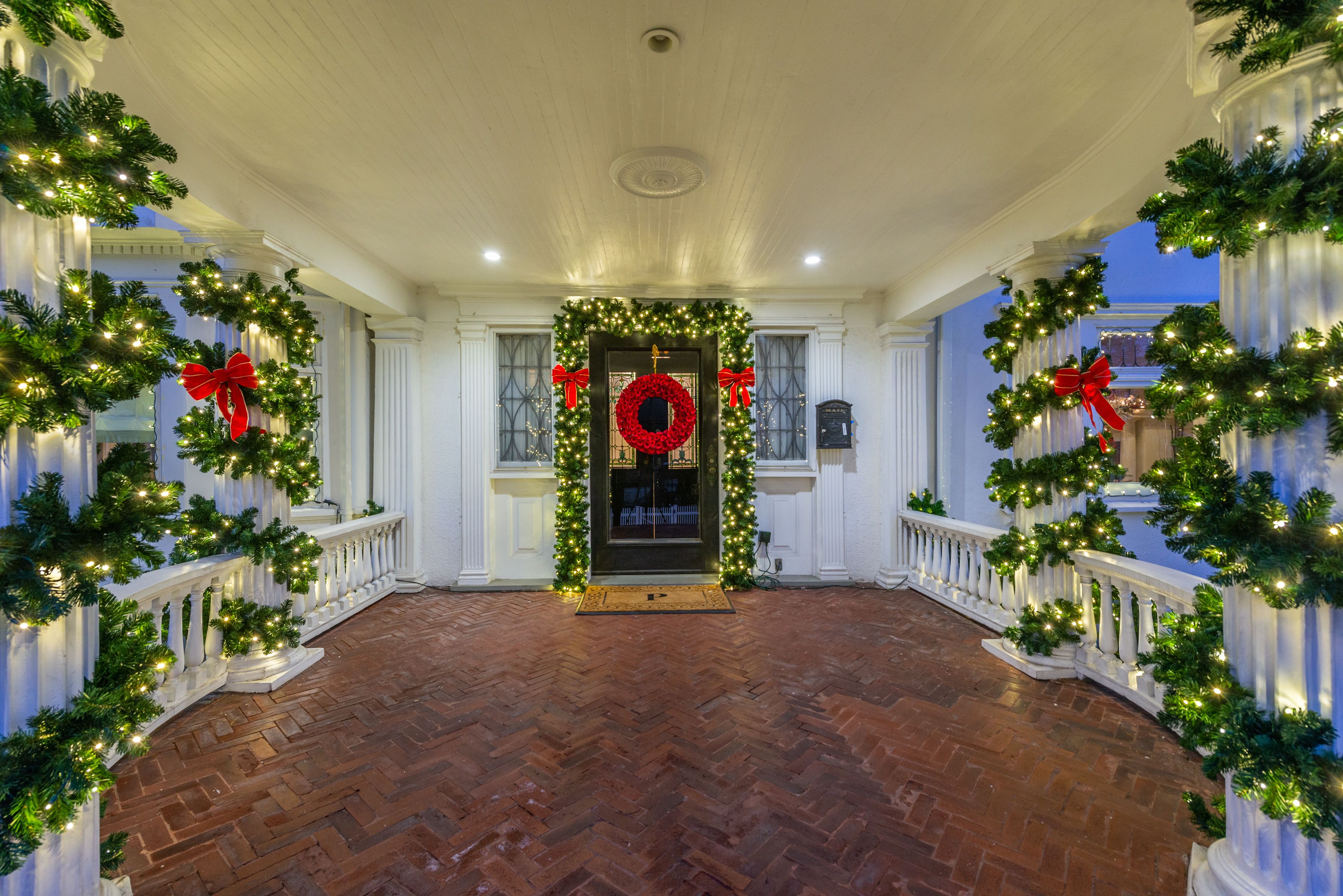 Entry porch with garland and a wreath