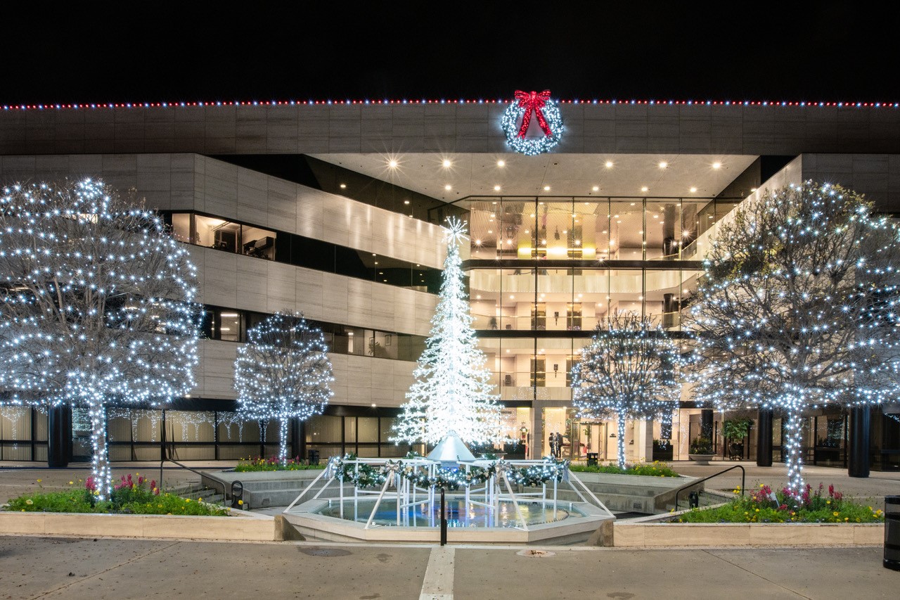 Courtyard with lit trees and a crystal tree centerpiece