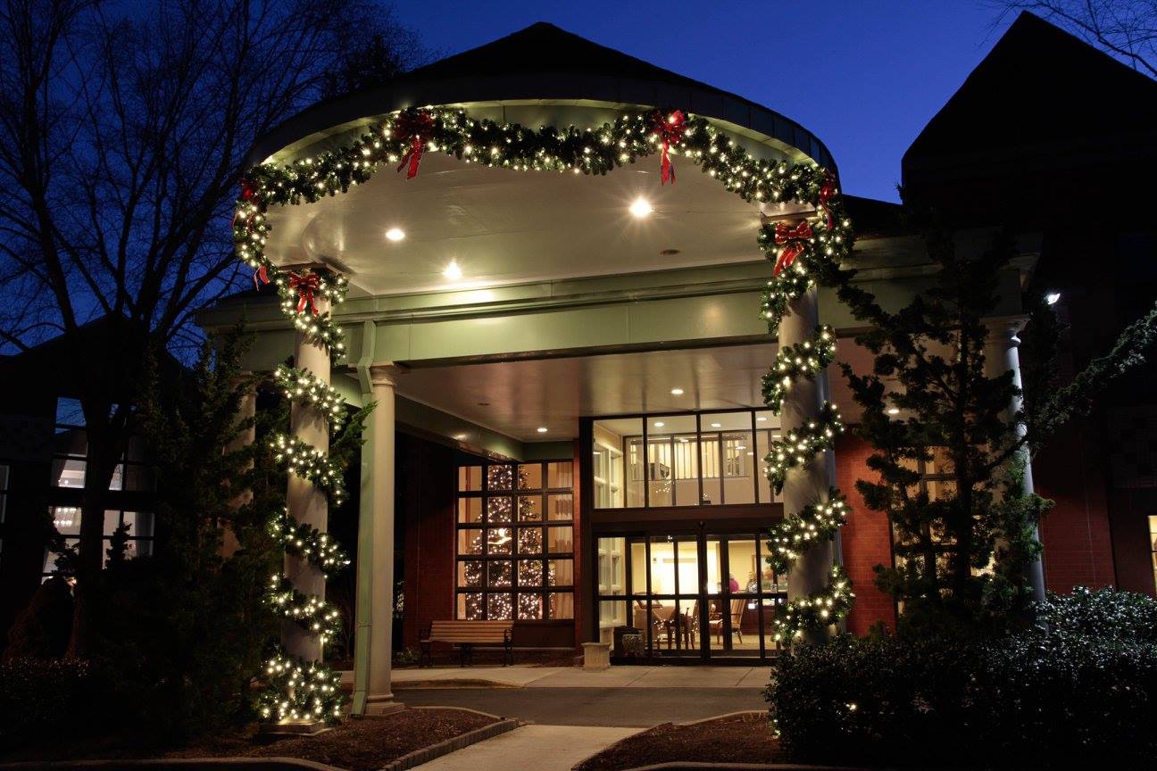 Restaurant entrance framed with lighted garland at night