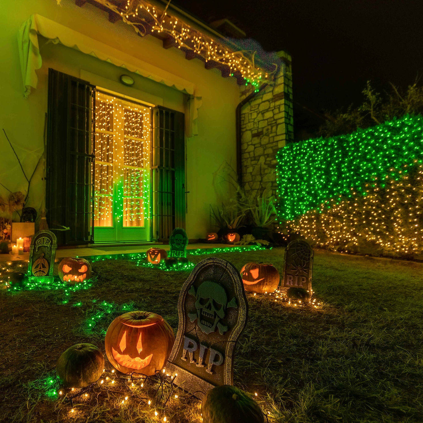 Commercial building decorated with holiday lighting at night