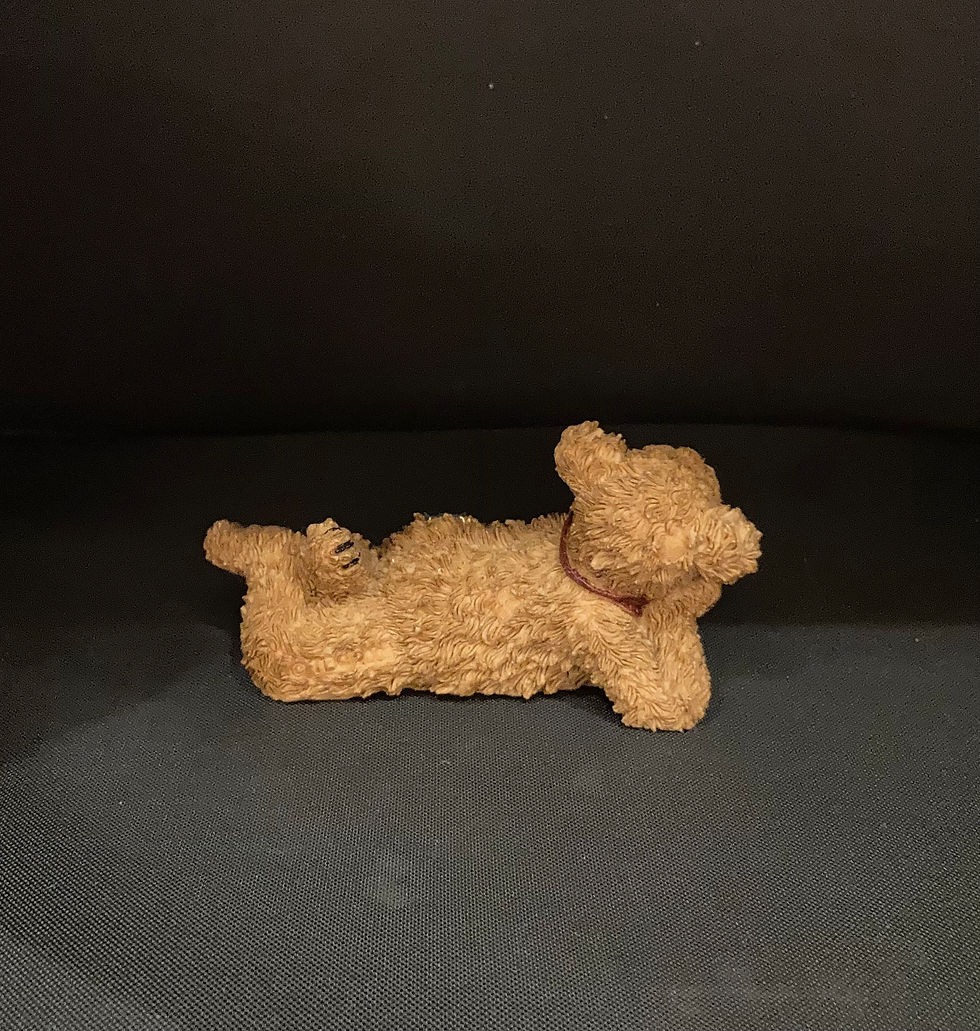 Thumbnail: Bear laying on his stomach figurine rear view
