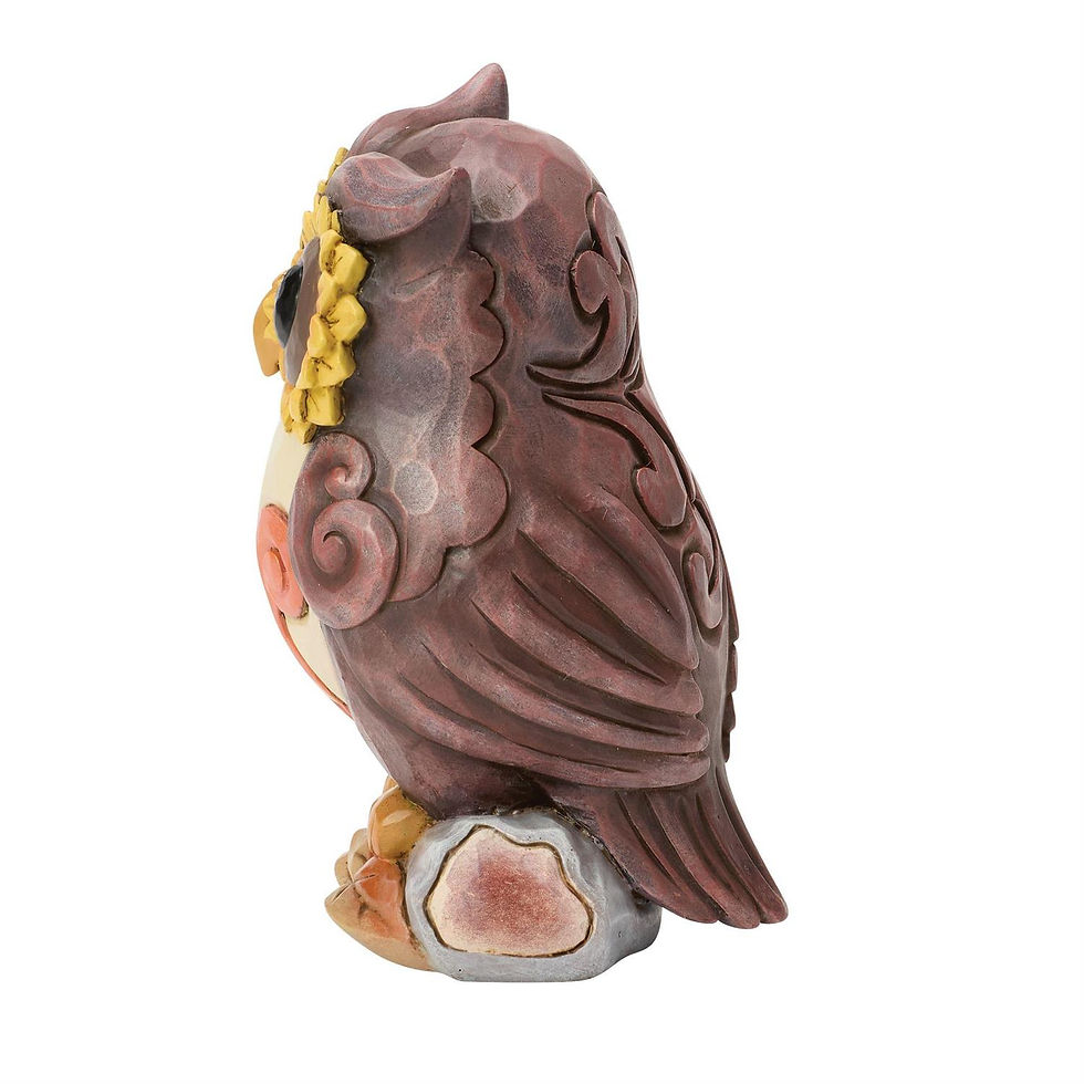 owl figurine side view