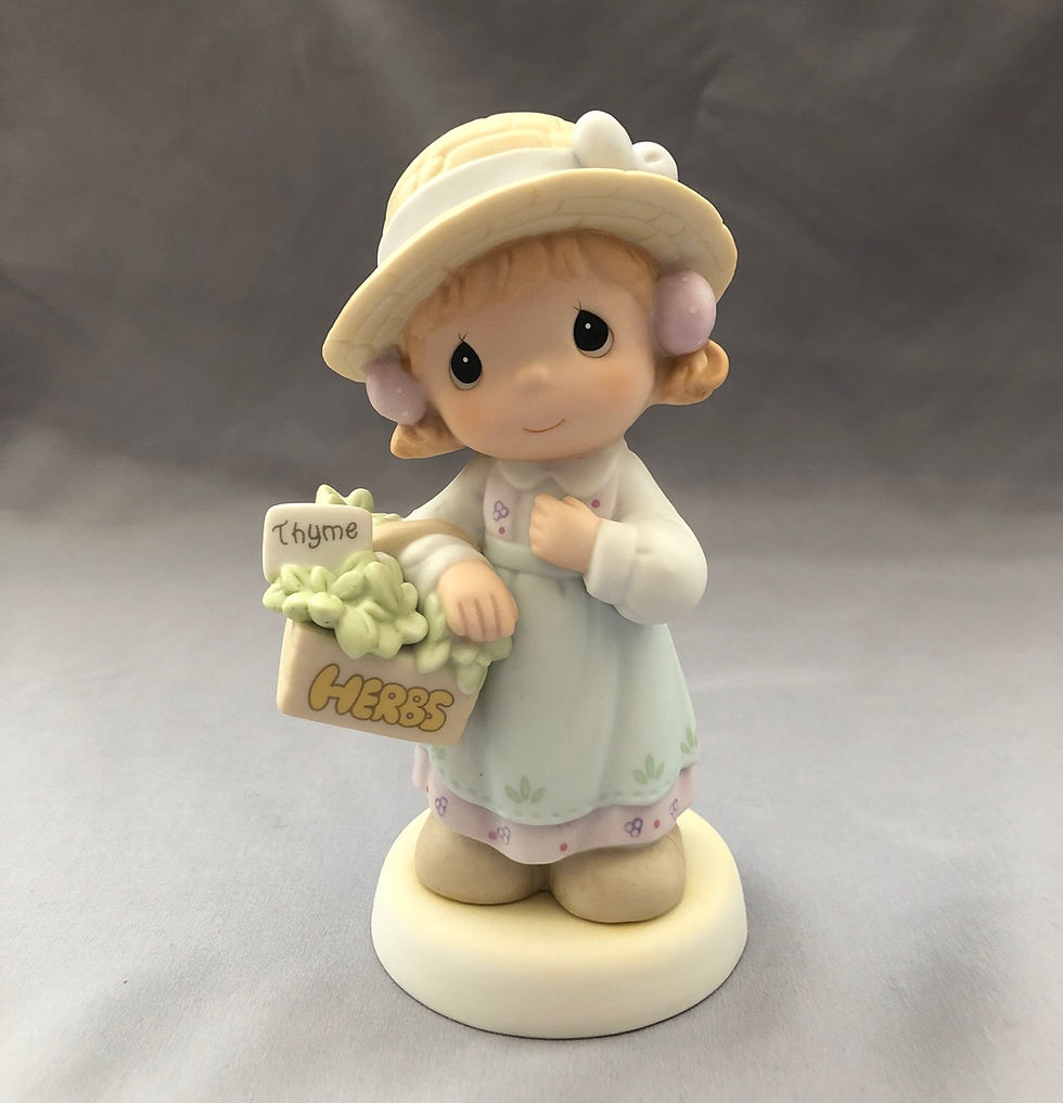 Thumbnail: Precious Moments girl wearing a Hat and a basket of herbs figurine front view