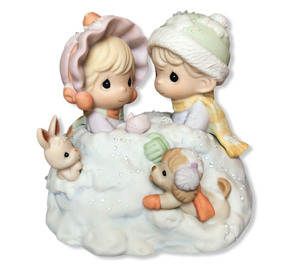 Precious Moments boy and girl in snow pile figurine front view