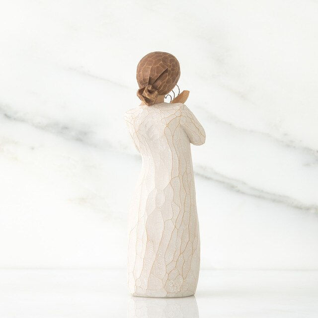 Thumbnail: willow tree girl holding wire hearts back view