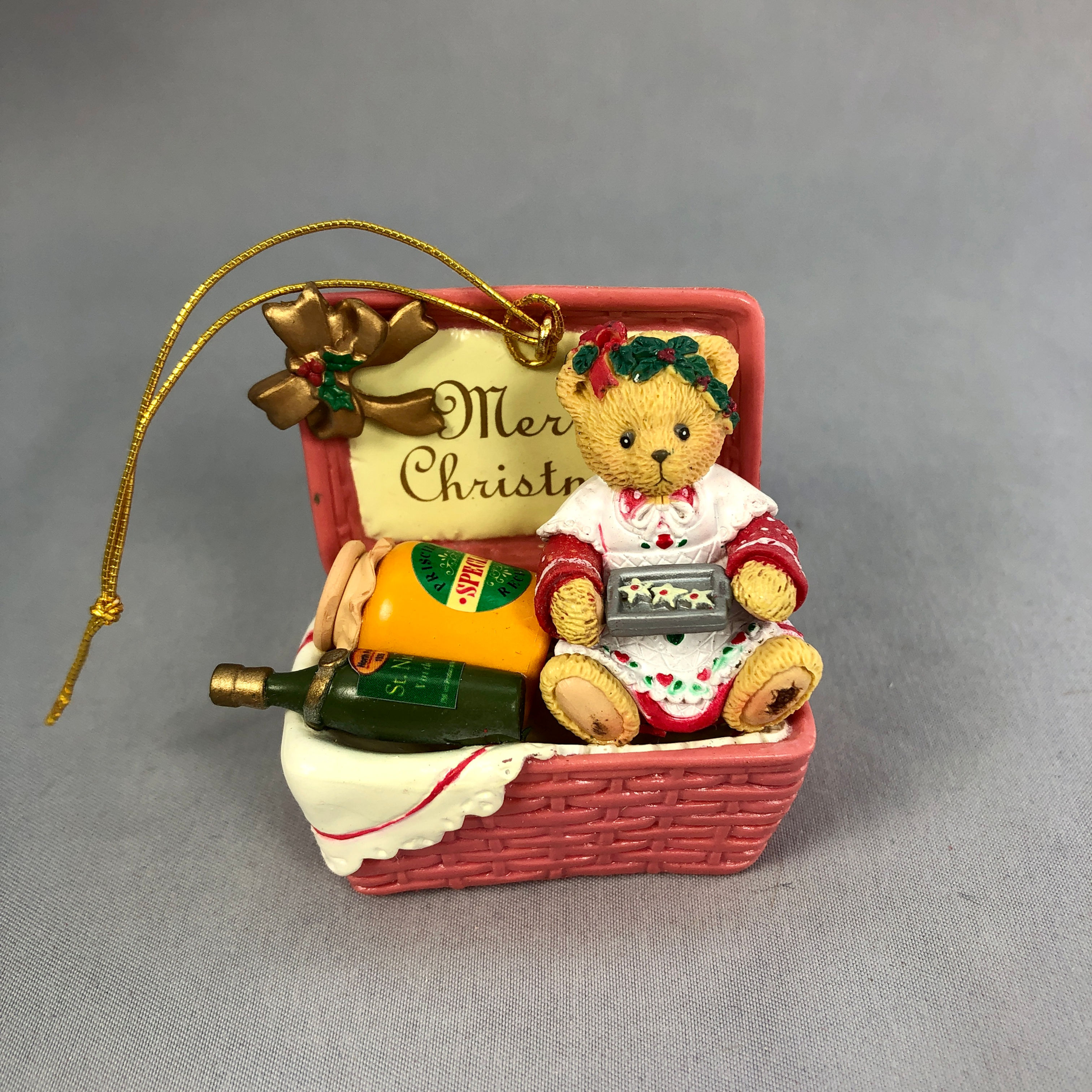 Cherished Teddies bear in a red basket ornament front view