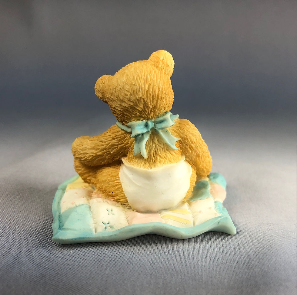 Thumbnail: Baby bear boy on Quilt figurine rear view