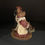 Thumbnail: Bear with baked cookies and cub figurine side view