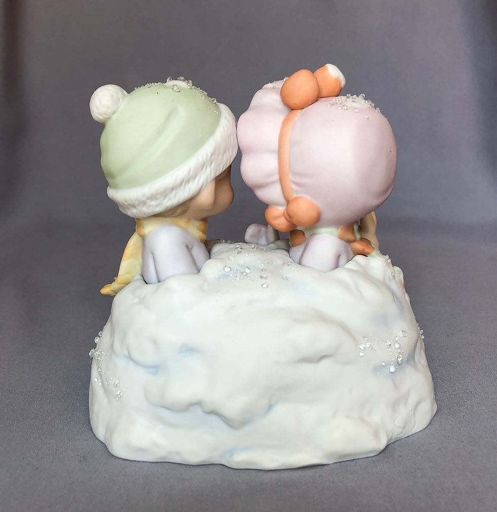 Precious Moments boy and girl in snow pile figurine rear view
