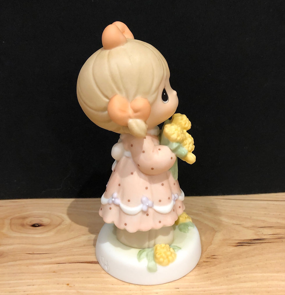 Thumbnail: Precious moments girl holding a bouquet of dandylion flowers figurine