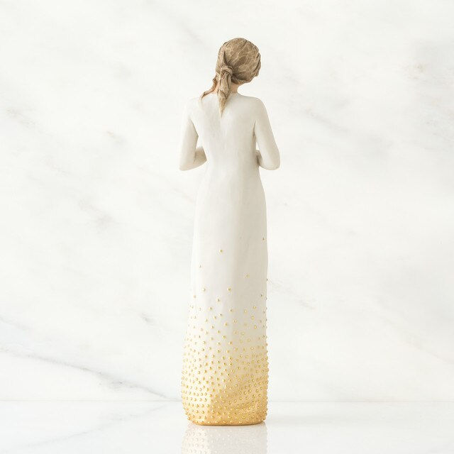 Thumbnail: Willow Tree Woman holding a candle back view