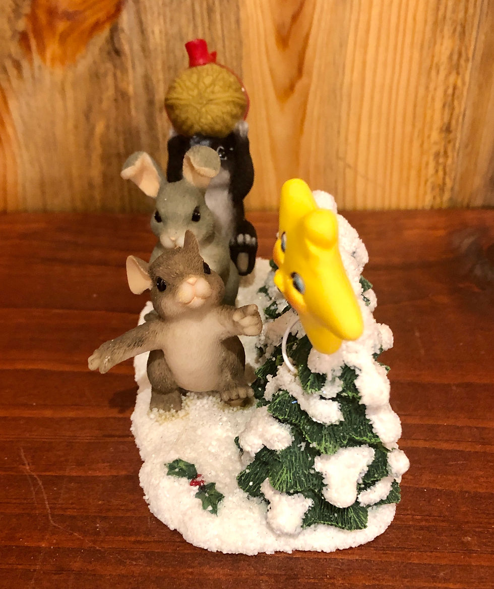 Thumbnail: mouse bunny and a skunk following a star figurine side view